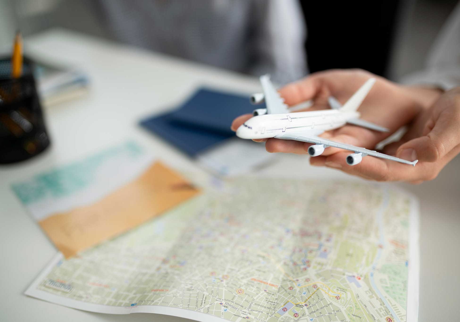 close-up-hands-holding-small-plane